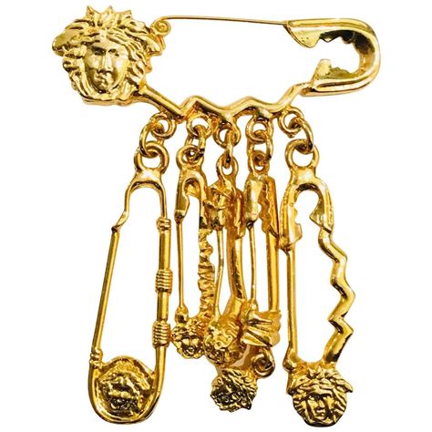 versace gold pin|Versace safety pin.